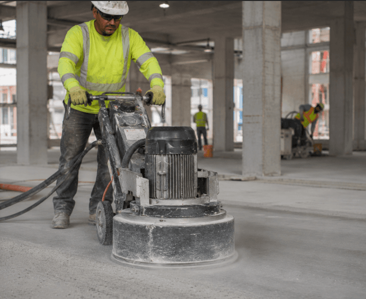 Diamond Products floor grinder leveling a concrete surface during construction